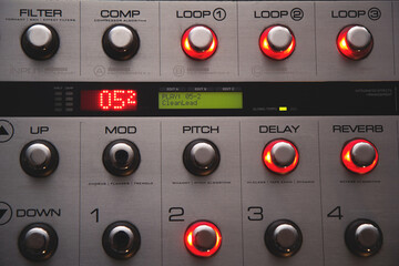 Foot controller in recording studio, work on music in progress: filter off, loops on (mod, pitch,...