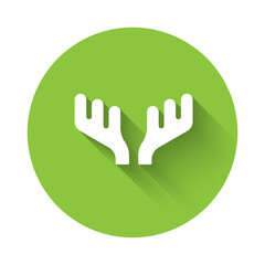 Obraz premium White Deer antlers icon isolated with long shadow background. Hunting trophy on wall. Green circle button. Vector