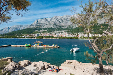 Makarska, Croatia, The Adriatic sea and harbour around  the city. - obrazy, fototapety, plakaty