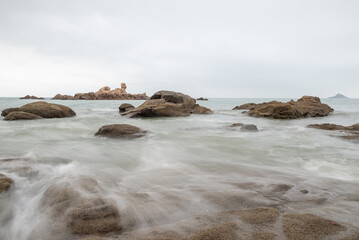 Cloudy morning, sea water, reefs and islands