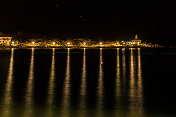 Fototapeta na wymiar Makarska, Croatia, Night views of the illuminated boardwalk.