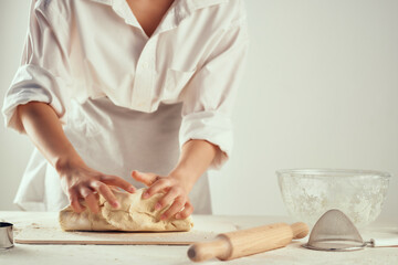 kneading dough in the kitchen rolling pin baking homework
