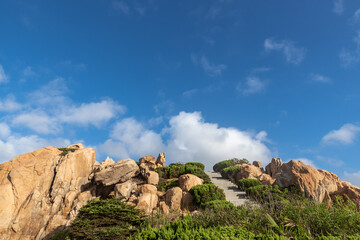 Fototapeta premium Stones of various shapes weathered by the sea under the blue sky