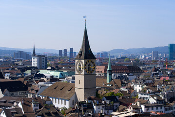 Fototapeta na wymiar Aerial view over City of Zurich with protestant church St. Peter in the middle on a beautiful late summer day. Photo taken September 8th, 2021, Zurich, Switzerland.
