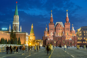 Obraz premium Moscow Red Square. Russia night. People on red square. Moscow Kremlin. People near Moscow Kremlin. Red Square with blurred faces. Travel to capital of Russia. Tourism in Russian Federation.