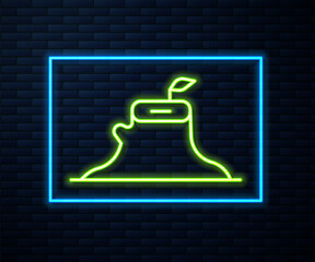 Glowing neon line Tree stump icon isolated on brick wall background. Vector