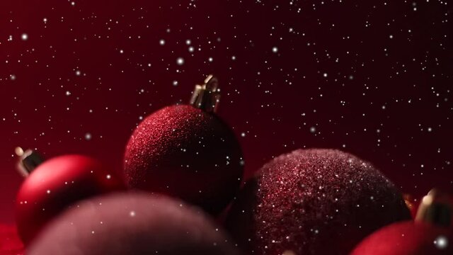 Snowy Christmas holidays background, snow and red baubles as festive winter decoration. High quality FullHD footage