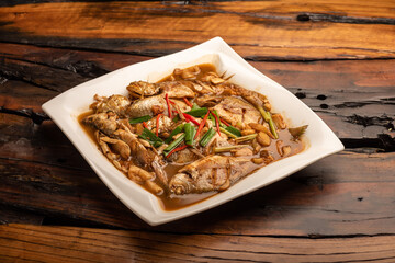 Traditional Chinese banquet dishes, boiled sea fish with yellow sauce