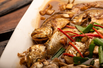 Traditional Chinese banquet dishes, boiled sea fish with yellow sauce