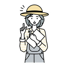 立って書類を手に持って何かひらめいた農家の女性