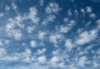 White cirrus clouds and blue sky. Background image.