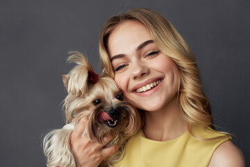 beautiful woman with a small dog makeup posing cropped view fashion