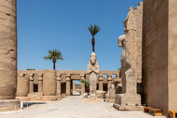 The statue of Ramses II with his daughter Merit-Amon in the temple of Amun-RA in Karnak, Luxor,...