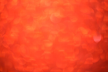 Red bokeh background. Festive Christmas shiny background. Glittering red light.