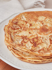 Stack of thin pancakes crepes. Close up view, selective focus. Tradicional asturian gastronomy.