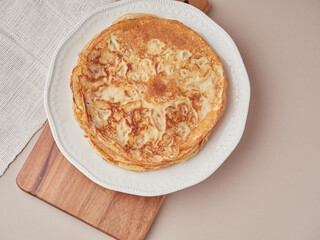 Thin pancakes crepes in a plate. Tradicional asturian desert.Top view.