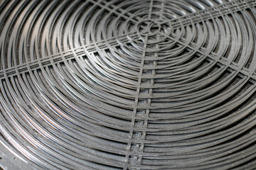 Closeup of industrial round metallic fan mesh made with laser cutting