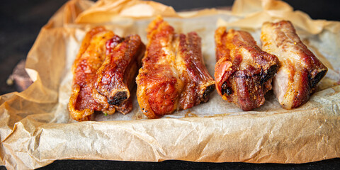 pork ribs or beef fried grill B-B-Q fatty food spices spicy marinade fresh portion ready to eat meal snack on the table copy space food background rustic. top view