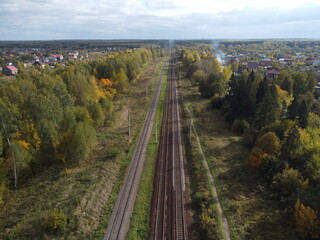 Fototapeta na wymiar Empty railway at sunny autumn day