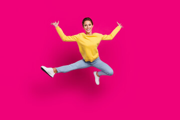 Full length body size view of attractive flexible cheerful girl jumping dancing having fun isolated over bright pink color background