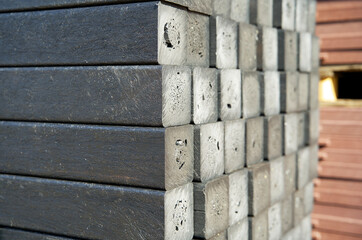 Close-up of circular construction material made from re-used waste plastics on a recycling plant