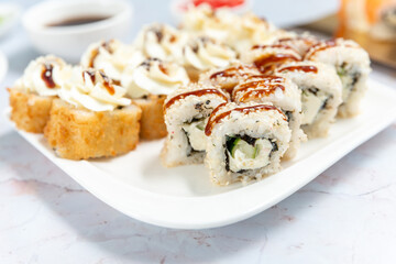 sushi rolls on a white plate on a white background