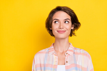 Photo of dreamy nice happy young woman smile look empty space imagine idea isolated on shine yellow color background