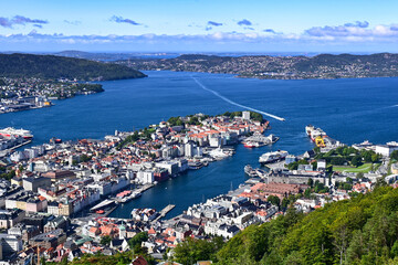 Aerial bird view of Bergen city and harbour with ferry entering the port