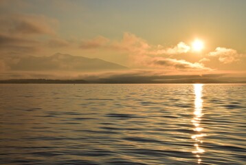 sunset over the lake with waves