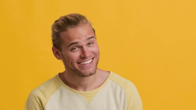 Positive Young Guy Grimacing, Pointing At Camera And Saying Gotcha