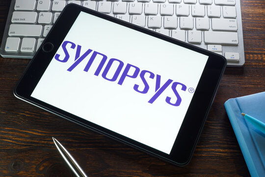 KYIV, UKRAINE - August 21, 2021. Synopsys Inc logo on the tablet and keyboard.