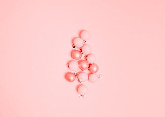 Top view of Christmas composition on pastel pink background. Holiday greeting card with copy space to text.