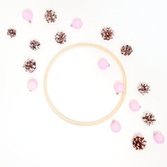Christmas composition. Cones, pink decorations on white background.  Flat lay, top view, copy space.