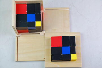 Montessori binomial and trinomial cubes