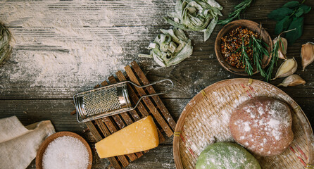 Fresh italian uncooked homemade pasta. Making homemade pasta. Fresh italian traditional pasta with ingredients. Toned image.