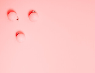 Top view of Christmas composition on pastel pink background. Holiday greeting card with copy space to text.