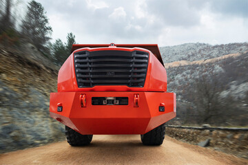 Autonomous self-driving mining truck on mountain road. Concept