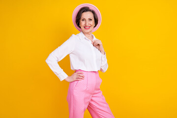 Profile side photo of aged attractive woman happy positive smile confident wear glamour outfit isolated over yellow color background