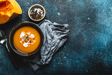 Pumpkin soup in bowl copy space