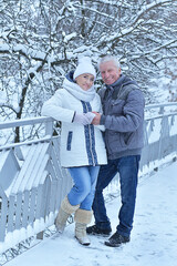 Portrait of a happy senior couple at winter outdoors