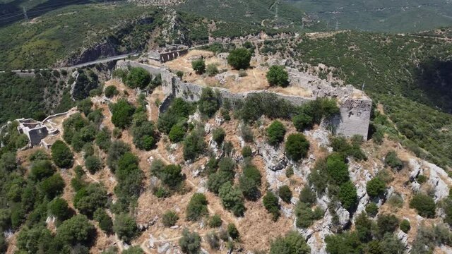 Cinematic aerial shot of the castle of Karytaina where the great protagonist of the Greek Revolution, Theodore Kolokotronis, used it as a home and also as a base