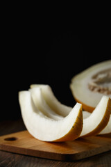 Melon, honey melon on wooden table background.