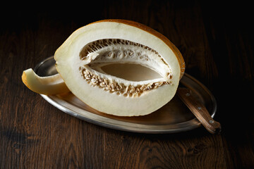 Melon, honey melon on wooden table background.