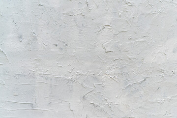 Texture of white plaster. Rough wall of the building.