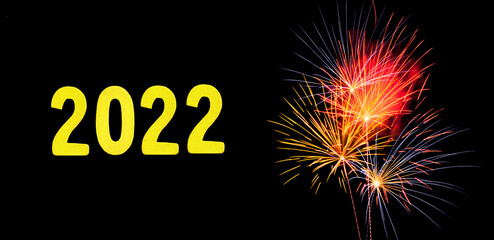 New Years card for 2022 with gold digits on a firework background