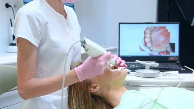 Dentist Using 3D Dental Intraoral Scanner For Scanning Teeth Patient's. Modern Dentistry And Healthcare Concept. Slow Motion Effect.