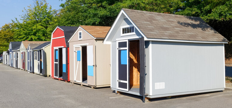 Row of demo garden sheds for sale.