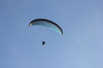 skydiver in the sky, gliding on a sports parachute