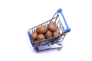 potatoes are in the shopping basket, isolated on a white background