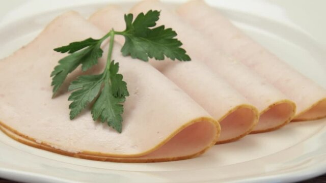 slices of cooked chicken fillet on a plate